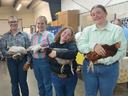 Four 4-H'ers pose with their chickens
