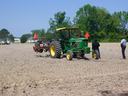 Image of tractor in a field preparing to plant