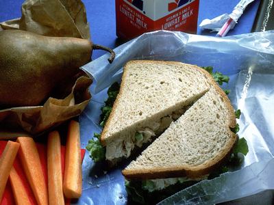 Chicken salad sandwich, carrot sticks, pear