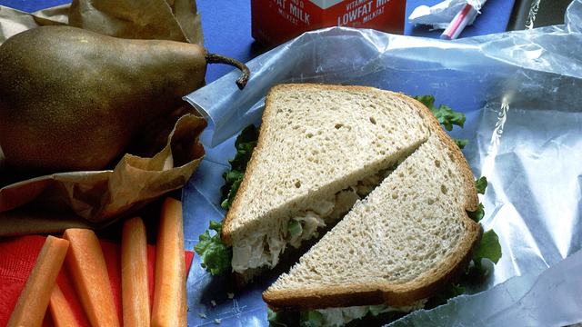 Chicken salad sandwich, carrot sticks, pear