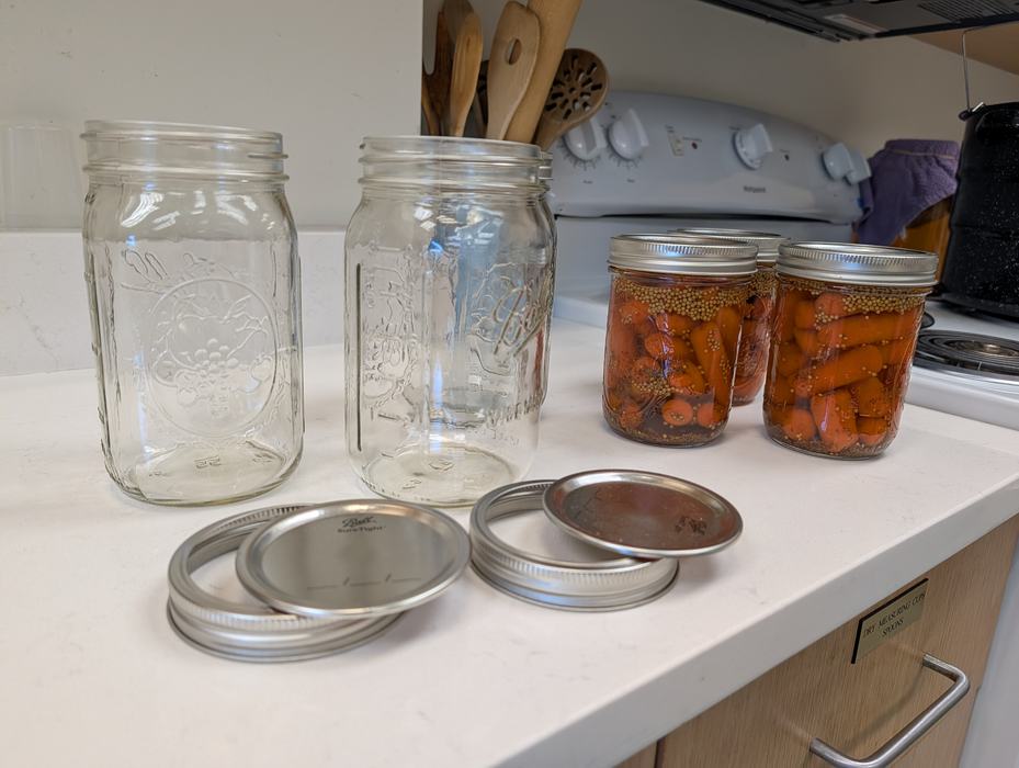 Jars and pickles ready to be canned.