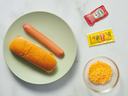 Uncooked hotdog on plate.