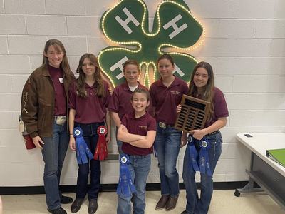4-H Horse Club winners posing with ribbons