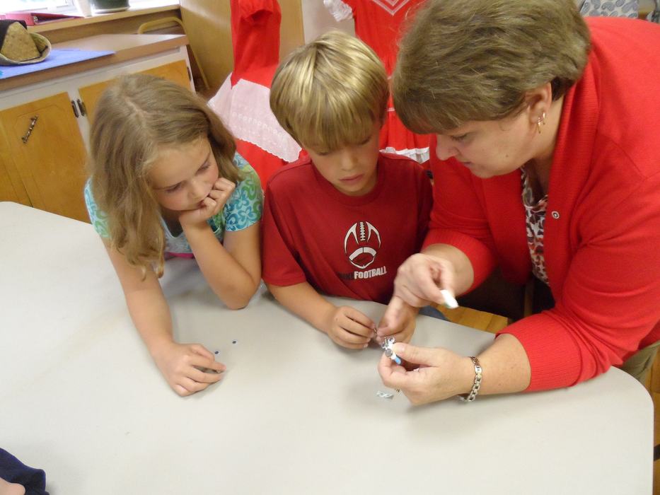 2012 4-Hers and volunteer instructor, design their Eco-Bot for 4-H National Science Day.