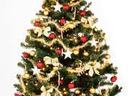 Decorated Christmas tree with gold ribbons, red ornaments, and wrapped presents underneath