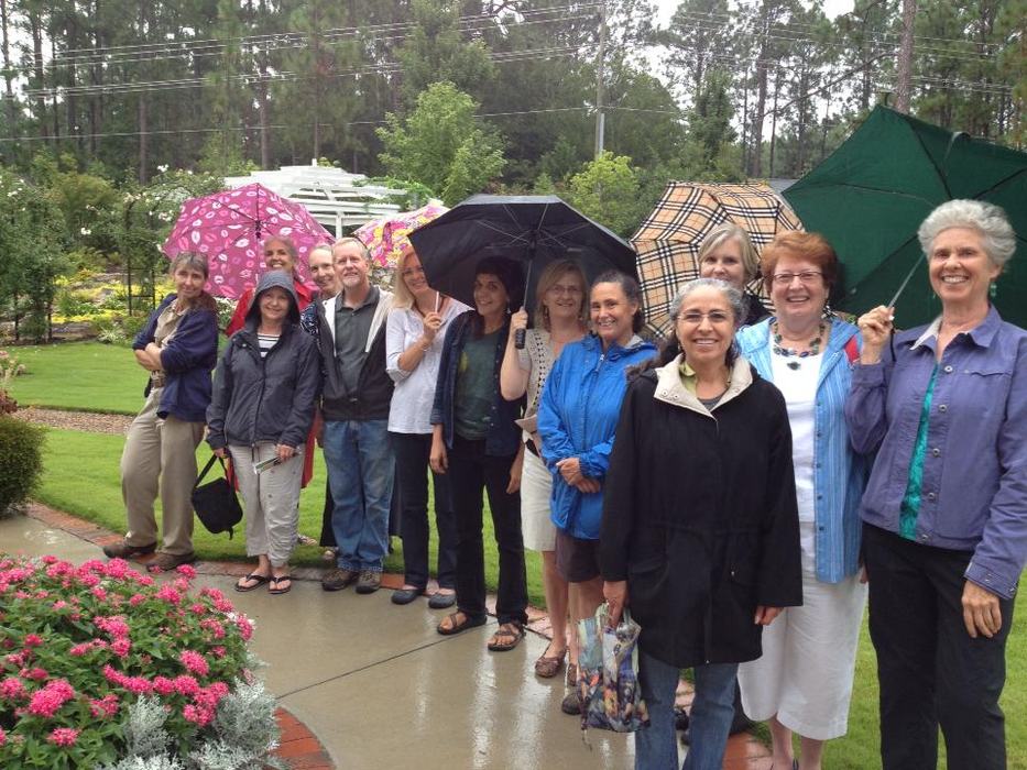 people standing in the rain