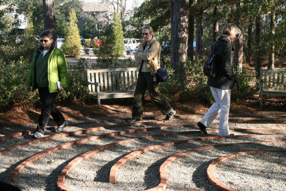 People walking in a meditation garden