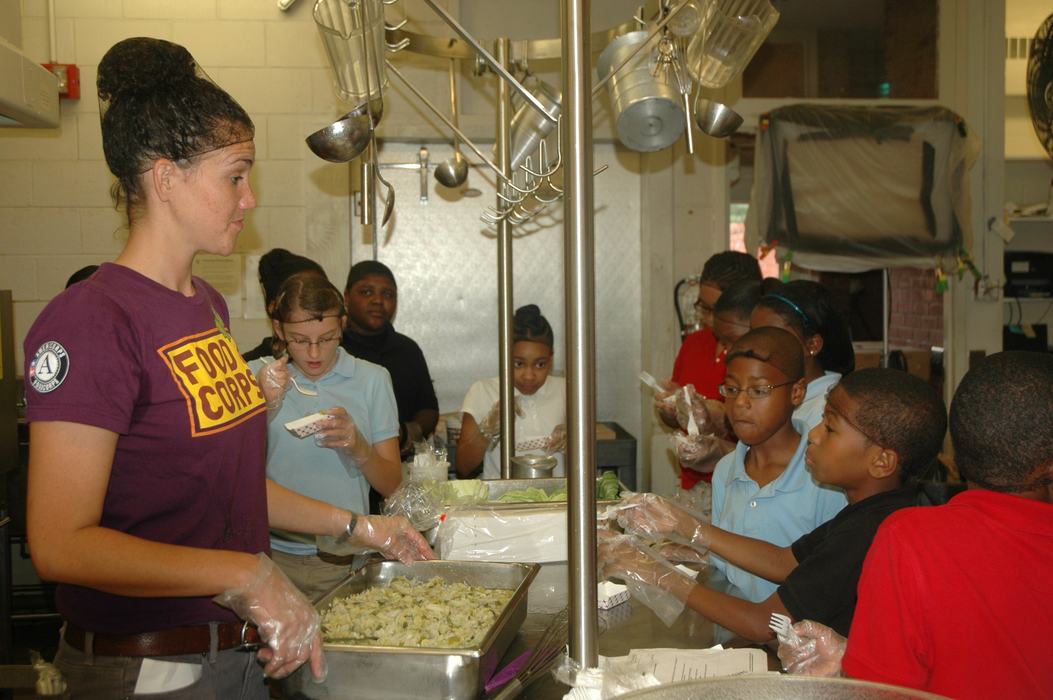 FoodCorps service member works with Warren County cafeteria staff to deliver cooking classes to students