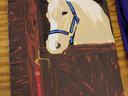 Painted cream horse with blue halter looking over stable door; red ribbon labeled "2"