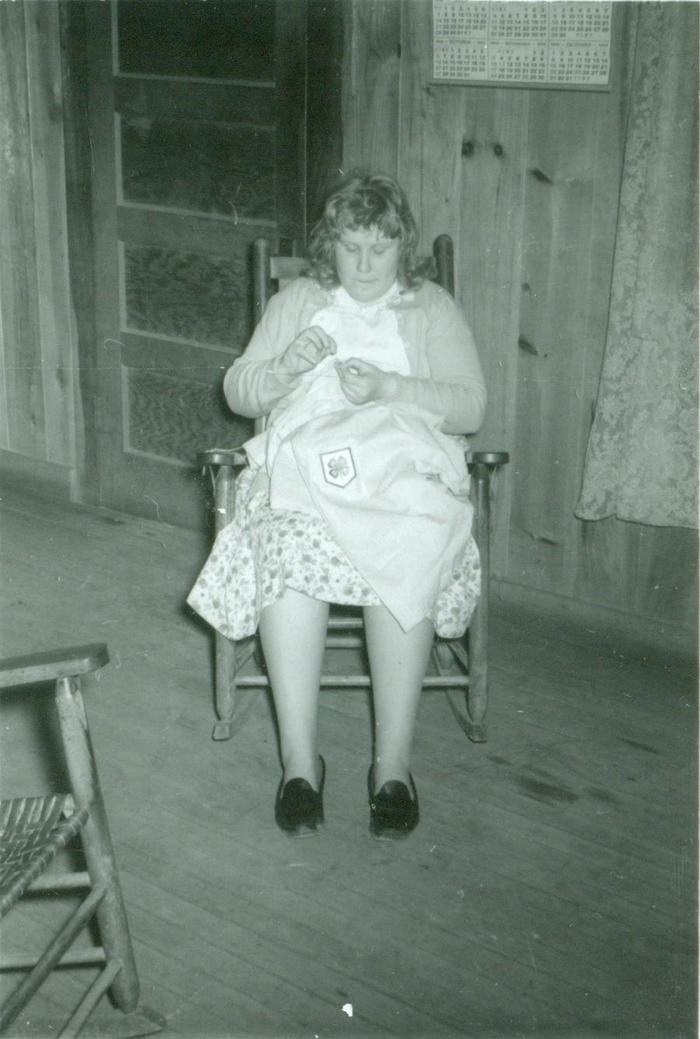 1963 - Mary Parris hand stitching 4-H skirt