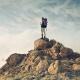 person standing on top of a mountain