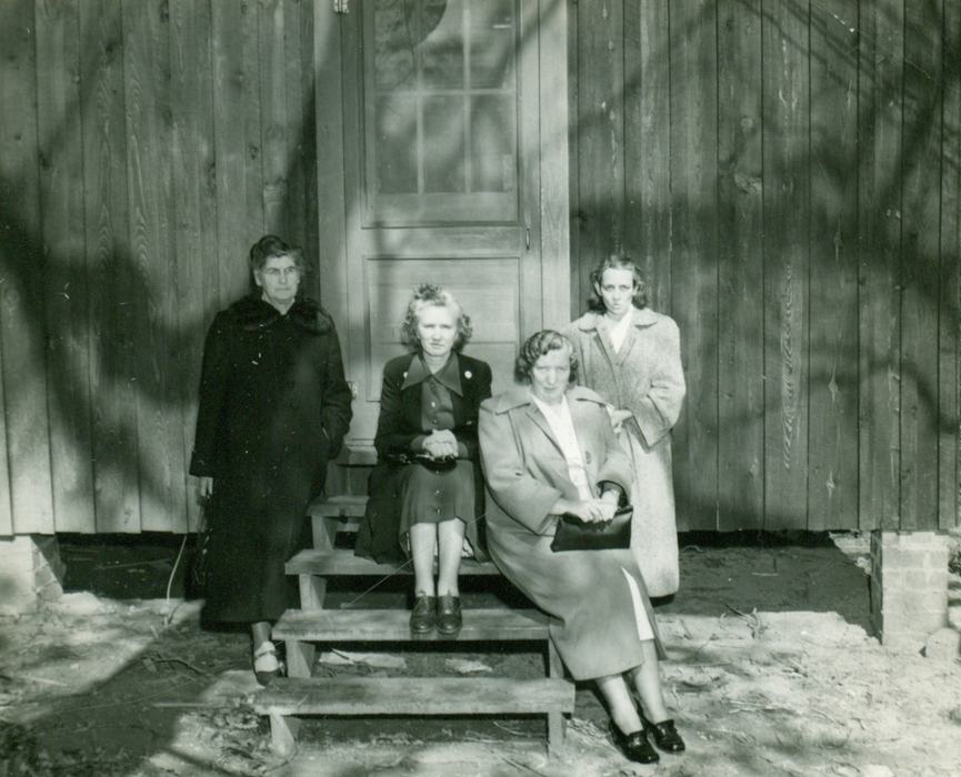 Swain County's 4-H cabin at Camp Seloub Waynesville. L-R Mrs. Eva McHan, Mrs. Fairie Moore, Mrs. Lula Bates, Mrs. Glennie Roberts