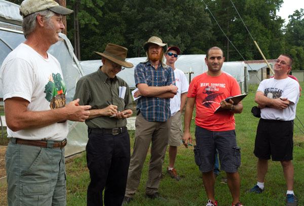 Farmer Alex Hitt talks with NCSU students at Peregrine Farm. Vegetable Specialist Dr. Chris Gunter (next to Alex) teaches the class. 