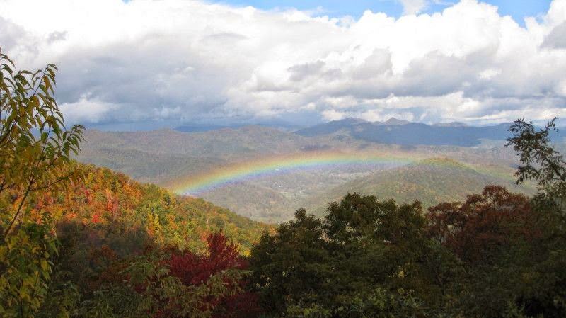 rainbow over mountain slopes