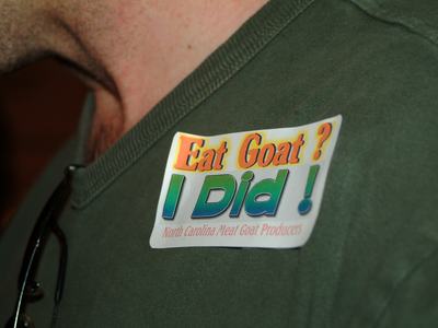 Sticker on green shirt reading "Eat Goat? I Did!" and "North Carolina Meat Goat Producers"