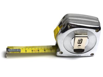 Retractable metal tape measure with yellow blade extended to 7 cm, marked "5m"