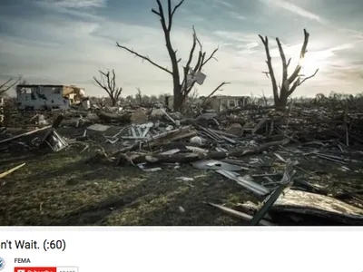 Tornado-damaged landscape with debris, broken trees and ruined homes; caption "Don't Wait. (:60)"