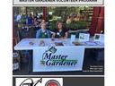 Two women at Master Gardener volunteer table, NC STATE Extension — 2015 Annual Report