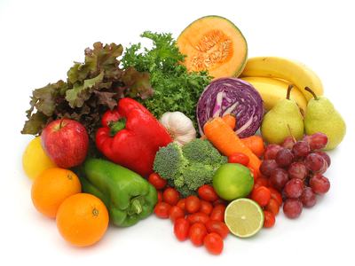 Assorted fruits and vegetables arranged on a white background