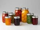 canning jars filled with fruit.