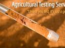 Soil core in probe; text: "Agricultural Testing Services" and "Unless you test, it's just a guess."
