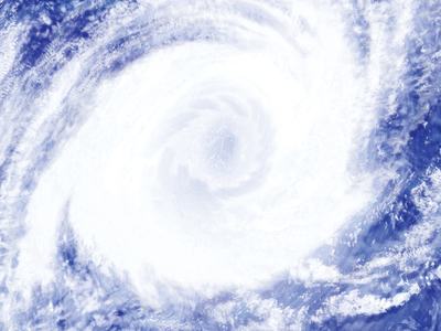 Satellite view of large spiral tropical cyclone with visible eye over the ocean