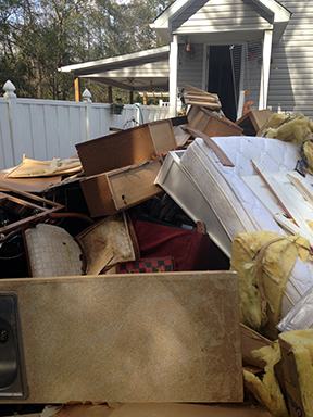 Storm debris piled in yards can become home to spiders.