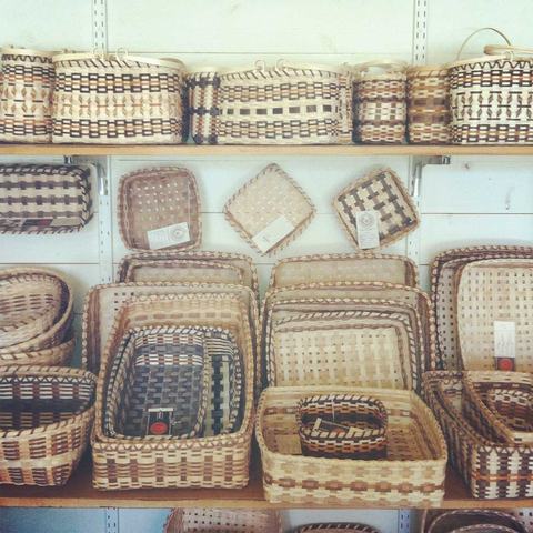 Shelves of woven baskets, various shapes stacked and nested on display