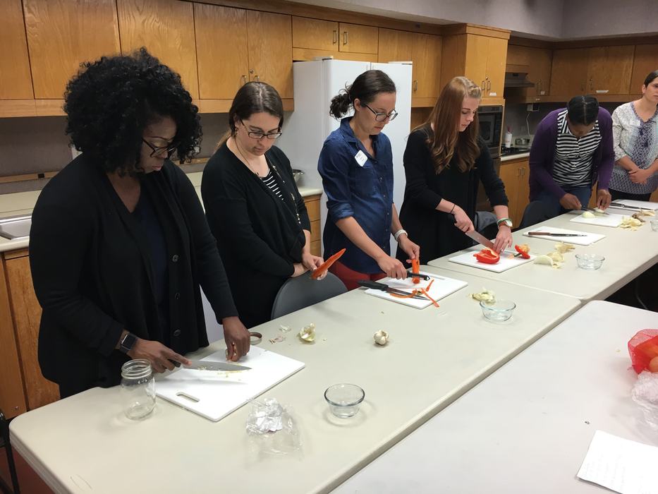 Family & Consumer Sciences Agents at the pilot training working on cooking skills. 