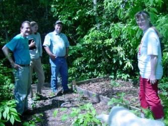 Bobbie Ammons (right) next to her bed of ramps in Cherokee County