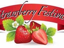 Red ribbon reading "Strawberry Festival" above whole and halved strawberries with leaves