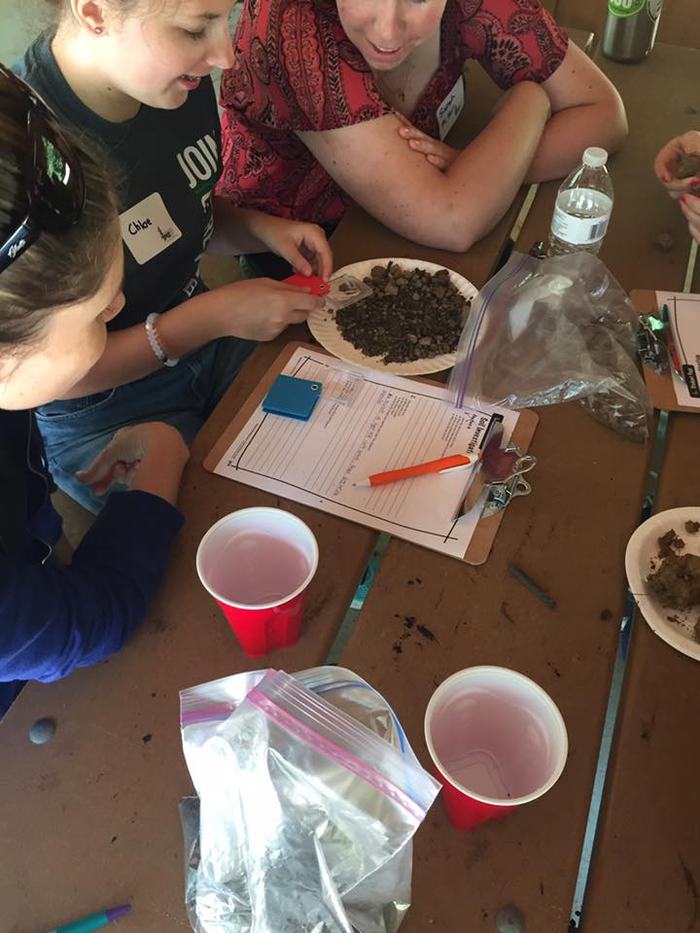 Educators investigate soil for PLT Activity #70, Soil Stories, in the K-8 guide
