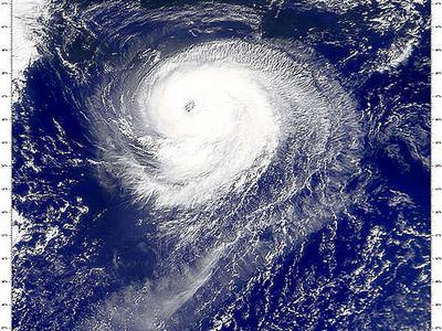 Satellite view of a hurricane with a well-defined eye over open ocean