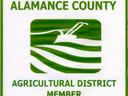 Alamance County Agricultural District Member logo with stylized plow and fields