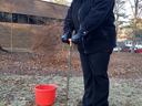 Virginia Lopez demonstrates how to take a proper soil sample with a soil probe.