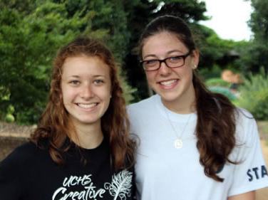 two young women smiling in the garden