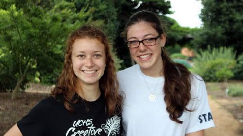 two young women smiling in the garden