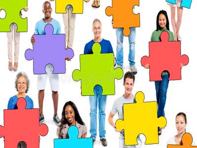 People holding large colorful jigsaw puzzle pieces