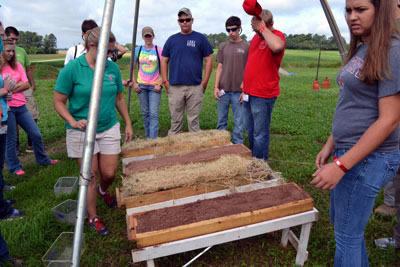 Studying the practice of soil erosion control. Students devise their own methods for protecting the soil from running off into the waterways