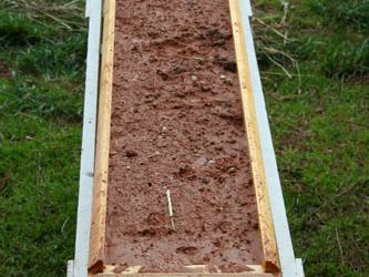 Demonstration of the effects of rain on bare soil.