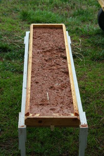 Demonstration of the effects of rain on bare soil.