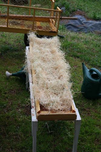 Example rainbox covered with excelsior, an aspen-tree based erosion control blanket