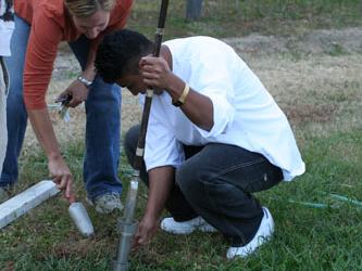 Students augering to determine their school soil types