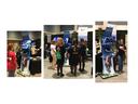 Trade show kiosk labeled DISCOVER NC DAIRY with cow graphic and attendees viewing screens