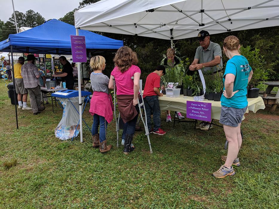 Visitors stopped by the Welcome Tent to register for door prizes. 