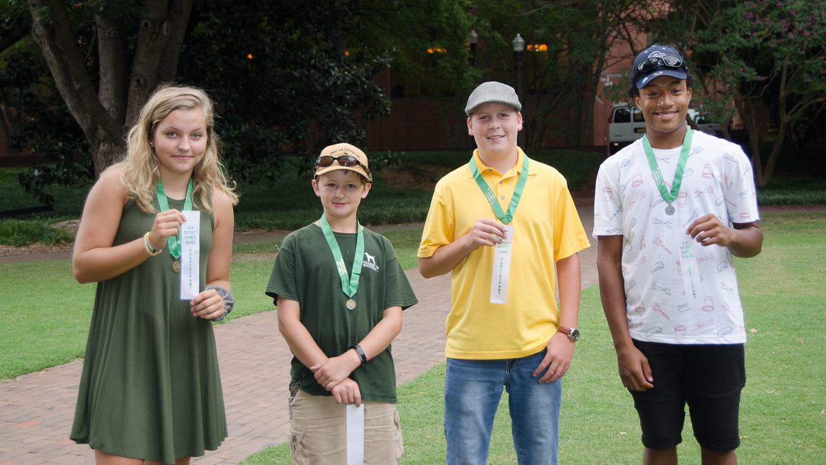 Group portrait of the four turkey char grill winners