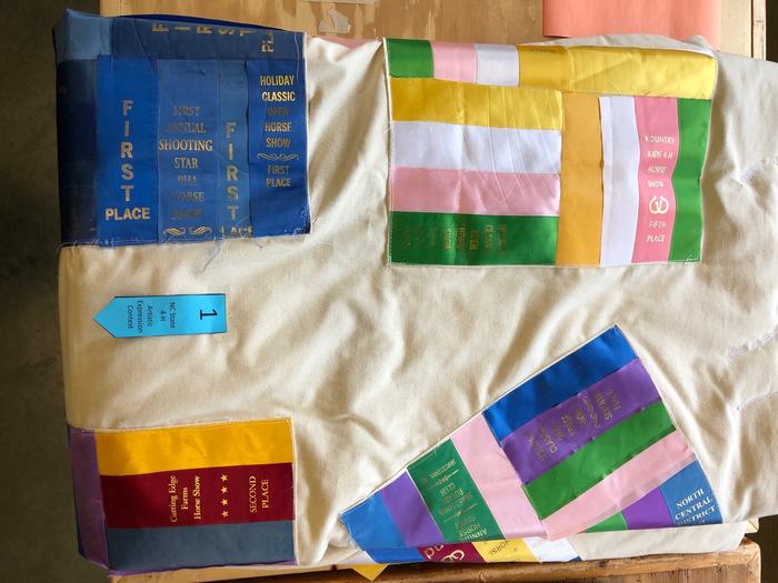 quilt designed with award ribbons