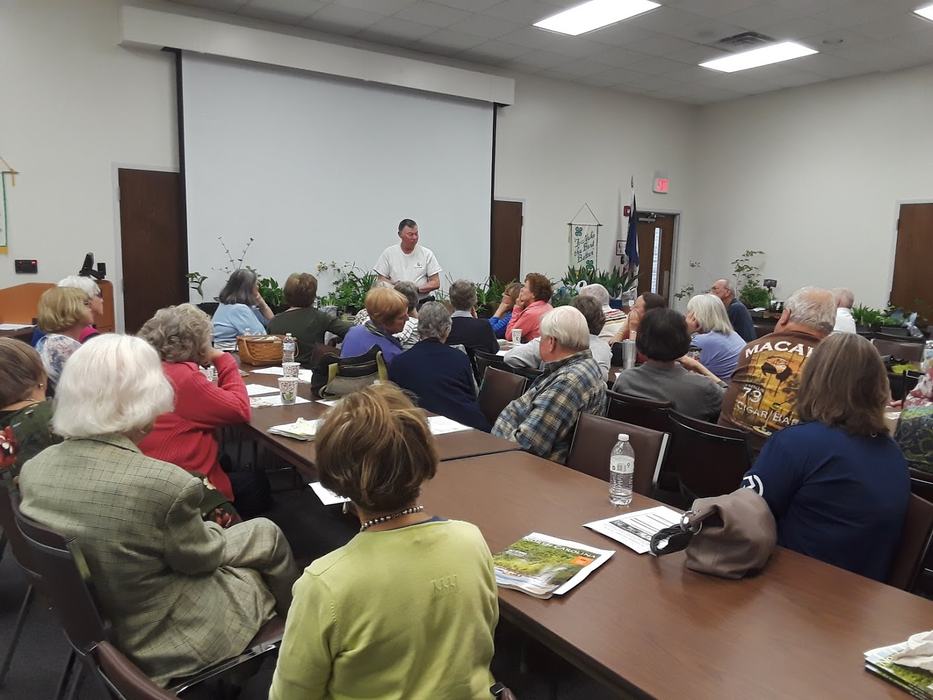 meeting participants listening to a speaker