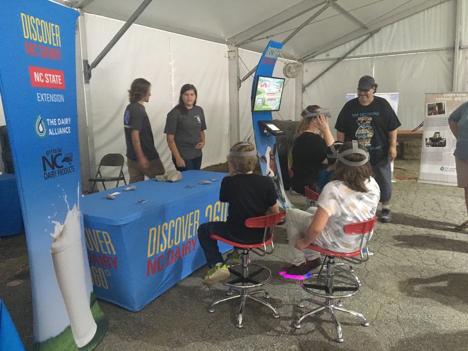 Discover NC booth and banners with visitors
