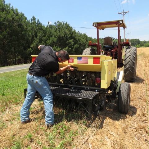 man adjusting drill settings